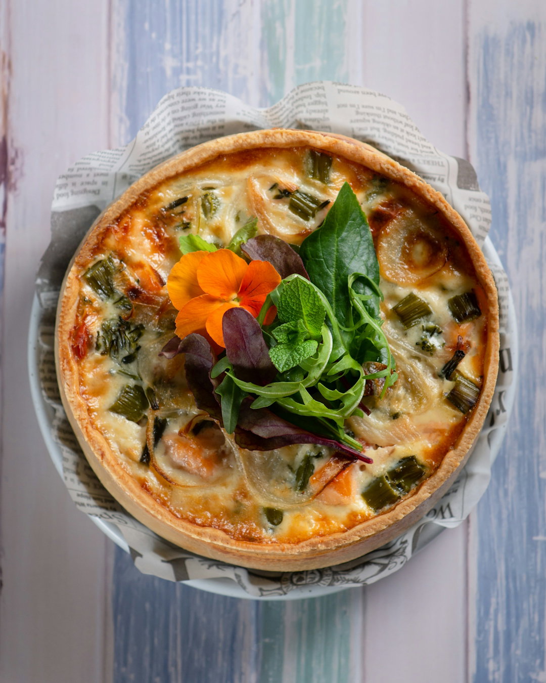 pizza-with-green-leaf-vegetable-on-white-ceramic-plate.jpg pizza with green leaf vegetable on white ceramic plate